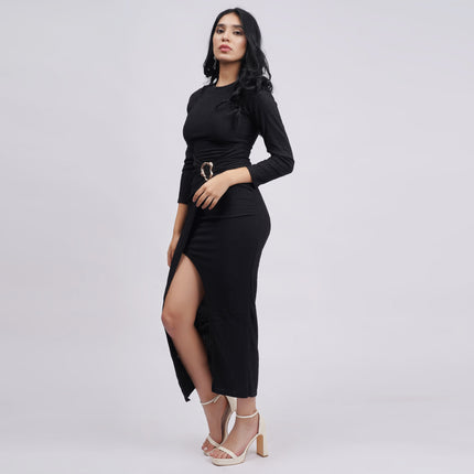 Woman wearing a black dress with a slit on a white background